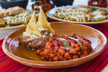 Papas with chorizo or potatoes with chorizo and refried beans, mexican food in Mexico City - obrazy, fototapety, plakaty
