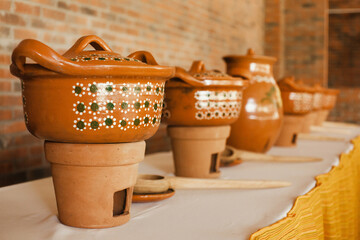 Buffet of traditional mexican food in clay pots in Mexico City
