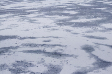 Texture of snow-covered ice on the river after a blizzard. Winter background