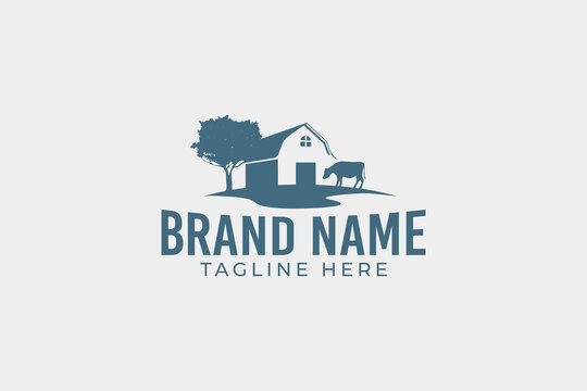 a simple farming logo with barn and cow images in a wide field