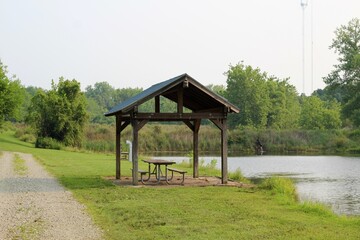 The empty wood shelter structure at the lake.