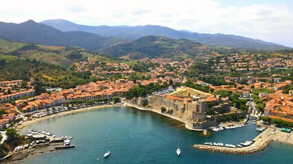 Fototapeta na wymiar Aerial view of the city of Collioure and Massif des Albères on the Côte Vermeille in Pyrénées-Orientales - France
