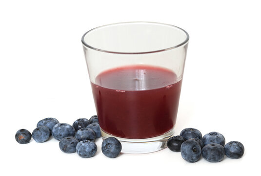 Delicious blueberry kissel and berries on light background