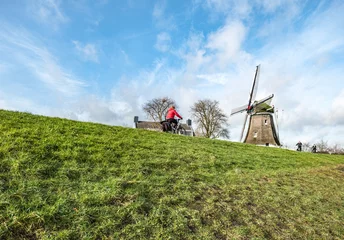 Foto auf Leinwand Windmill De Olde Zwarver in Kampen, Overijssel Province, The Netherlands © Holland-PhotostockNL