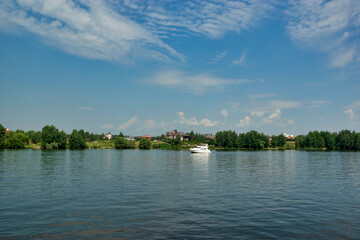 Fototapeta na wymiar Embankment of the Klyazmensky reservoir, river walk along the Moscow water channel, Russia