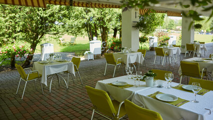 terrace summer cafe with tables and chairs for people, an empty institution for recreation, nobody