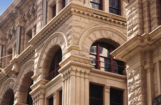 Close up of the architectural detailing of a refurbished heritage sandstone building. Now retail and office space. former headquarters for the American Equitable Life Assurance Society