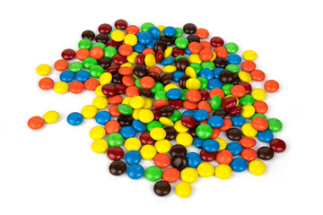 Colorful chocolate in and out of focus on white background.