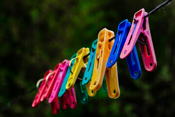 Clothespins. Colorful clothespins on the clothesline. Backgrounds.