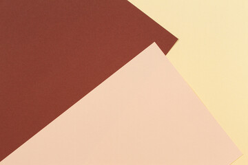 Color papers geometry composition background with yellow beige and brown tones