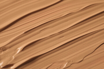 Fototapeta na wymiar Texture of liquid skin foundation as background, closeup