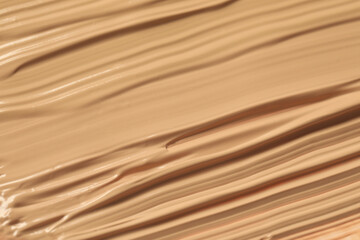 Texture of liquid skin foundation as background, closeup