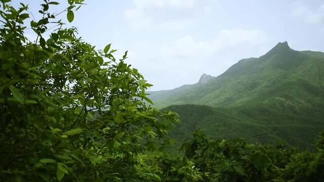 View of Green mountains and beautiful sky clouds at Girnar hills, Gujarat, India.