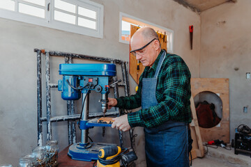 adult man using bench drill