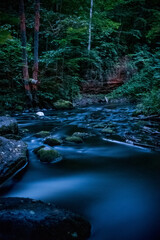 waterfall in the forest at night