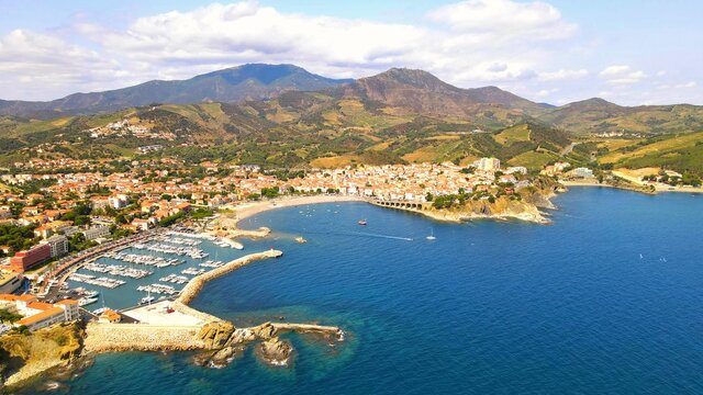 Aerial view from the sea of the city of Banyuls-sur-Mer and Massif des Alb&egrave;res on the C&ocirc;te Vermeille in Pyr&eacute;n&eacute;es-Orientales, France