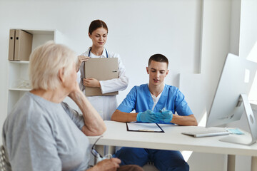 Fototapeta premium elderly woman patient examination by a doctor health care