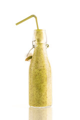 Bottle of delicious green kiwi or avocado or spinach smoothie with a straw isolated on white background. Healthy, detox and diet food concept