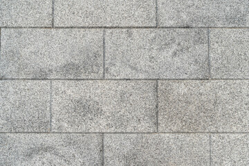 Naklejka premium The texture of natural gray granite tiles, background.