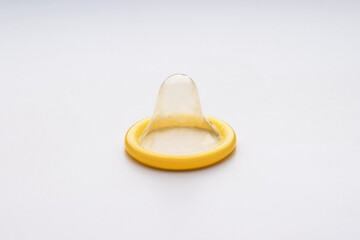 Condom on a white background, contraception
