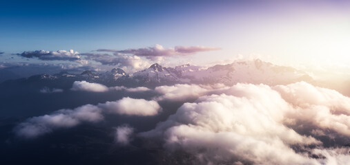 Aerial View from Airplane of Canadian Mountain Landscape, Tantalus Range. Sunny Sunset Art Render....