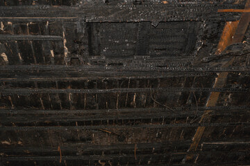 Burnt ceiling in an old building. House after the fire.