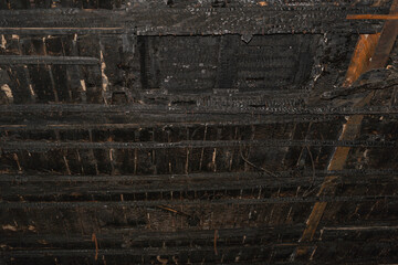Burnt ceiling in an old building. House after the fire.