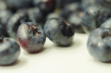 Closeup on fresh and ripe blueberries on a white background