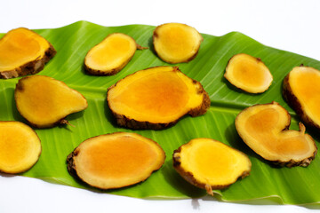 Phlai slices, Cassumumr ginger or zingiber montanum on green leaf