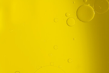 Abstract Macro Photography of a bubble on a yellow  colour water mixed with yellow food colour mix. Macro bubble photography with empty space available.