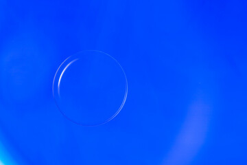 Abstract Macro Photography of a bubble on a blue colour water mixed with blue food color mix. Macro bubble photography.