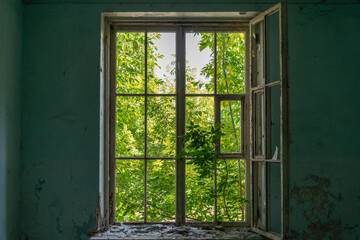 A window in a crumbling building. Inside view.