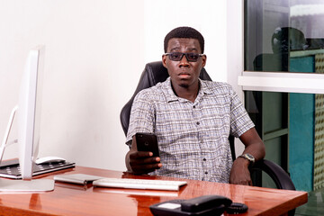handsome young businessman working in the office.