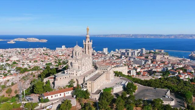 Marseille: Aerial view of city in France, basilica Basilique Notre-Dame de la Garde (la Bonne-m&egrave;re) on top of hill - landscape panorama of Europe from above