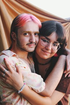 Soft lighting portrait of gender queer nonbinary friends couple together *4