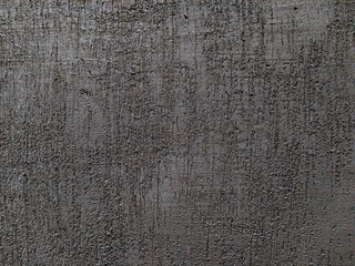 Grungy cement background with a texture of scratches and cracks made by trowel or spatula