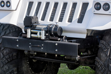 An offroad car recovery winch for pulling a vehicle from mud.