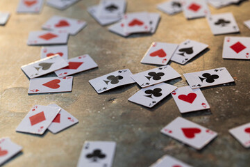 playing cards on a wooden table