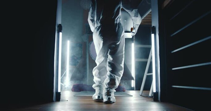 Epic cinematic shot, child in astronaut suit walks in dark room with lights to enter space ship, take off in white smoke