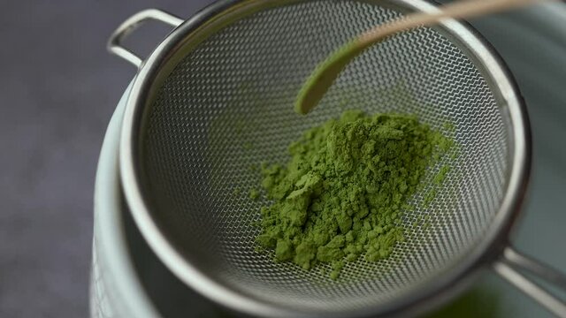 straining matcha powder with strainer