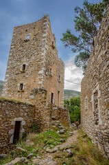 Fototapeta na wymiar Architectural and old historical towers dominating the area at the famous Vathia village in the Laconian Mani peninsula. Laconia, Peloponnese, Greece, Europe.sightseeing