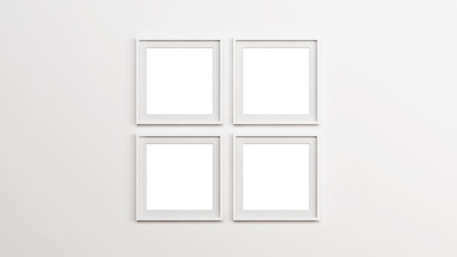 White square picture mockup frames. Four white square wooden frames on the empty white wall.