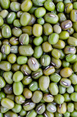 Dry organic green mung bean background after harvested from the farm, ready for  healthy food ingredient. Concept of agricultural product or carbohydrate food type