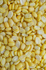 Group of dry organic split peeled mung bean backgound, ready for healthy or sweet food ingredient
