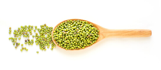 Top view of dry organic green mung bean seed pile in wooden spoon on white background