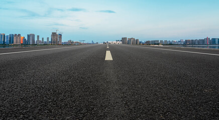 Fototapeta premium Skyline of Asphalt Pavement and Urban Architecture