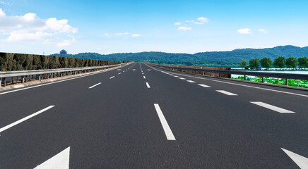 Skyline of Asphalt Pavement and Blue Sky and White Cloud