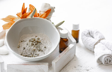 Spa composition with powder face mask and natural oils.