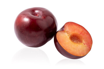 Naklejka na ściany i meble Dark red plum and half of a plum isolated on a white background.Ripe bright fruit on a white background.