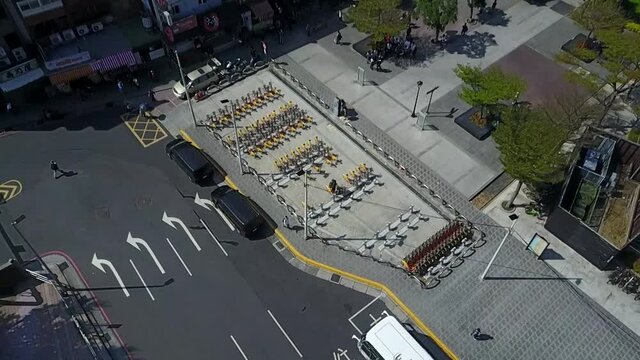 Aerial view of bicycle-sharing system station next to the Ocean. Asia, Taiwan, Tamsui.